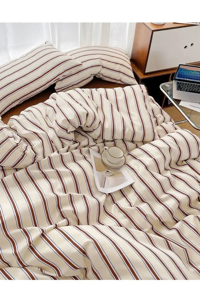 Simple Red and Blue Striped Duvet Cover and Four Piece Bed Sheet Set with Washed Cotton Bedding on the Bed