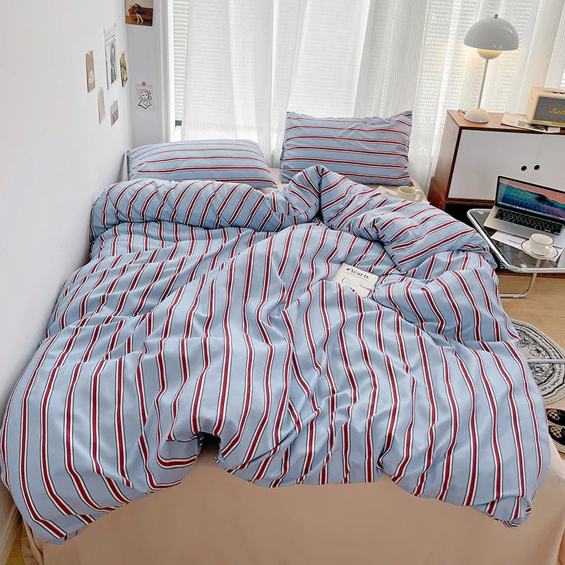 Simple Red and Blue Striped Duvet Cover and Four Piece Bed Sheet Set with Washed Cotton Bedding on the Bed