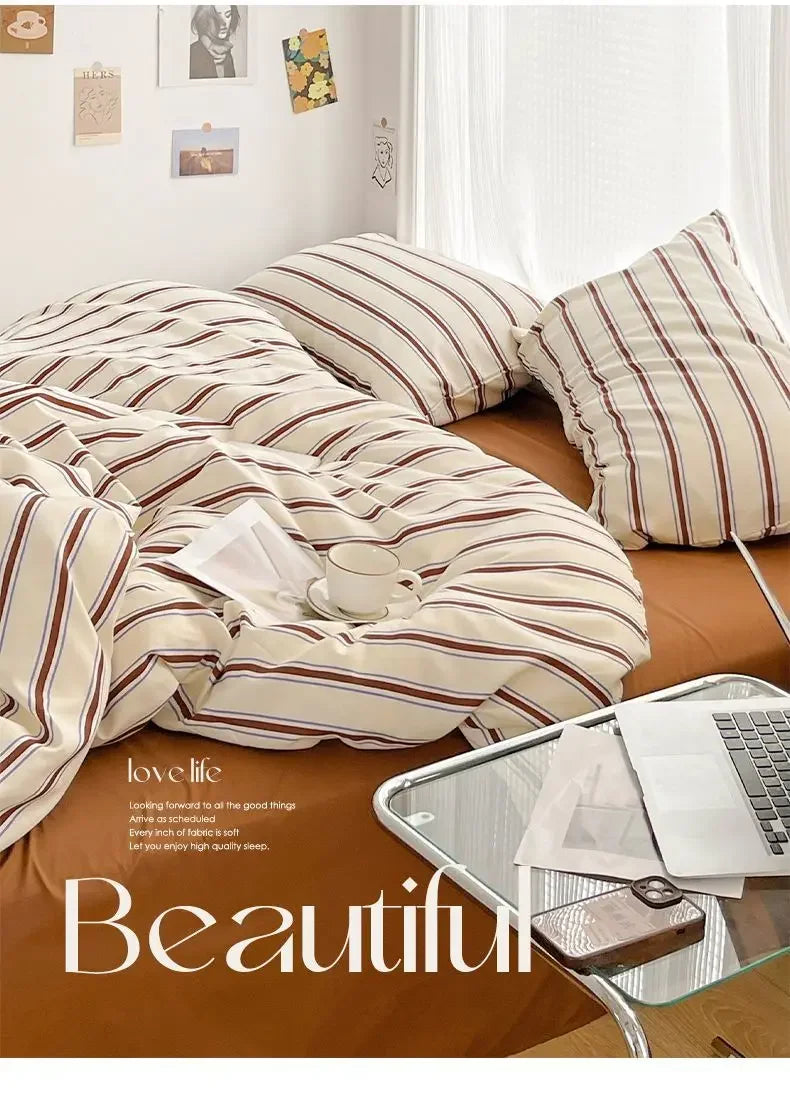 Simple Red and Blue Striped Duvet Cover and Four Piece Bed Sheet Set with Washed Cotton Bedding on the Bed