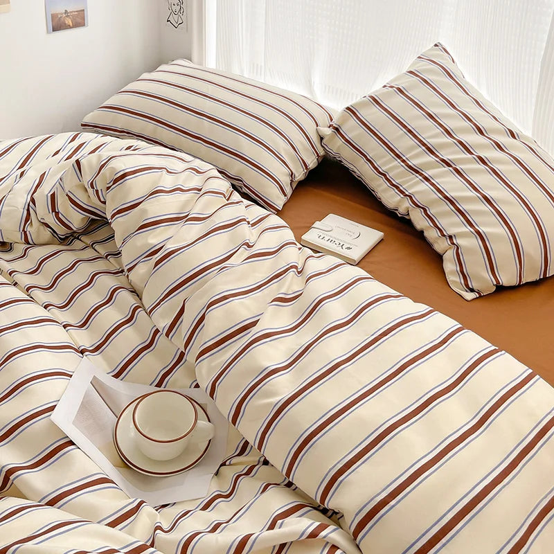 Simple Red and Blue Striped Duvet Cover and Four Piece Bed Sheet Set with Washed Cotton Bedding on the Bed