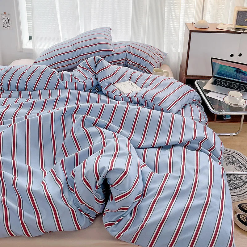 Simple Red and Blue Striped Duvet Cover and Four Piece Bed Sheet Set with Washed Cotton Bedding on the Bed