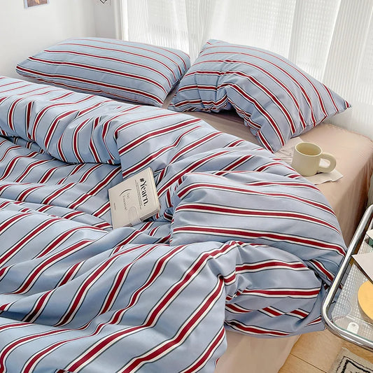 Simple Red and Blue Striped Duvet Cover and Four Piece Bed Sheet Set with Washed Cotton Bedding on the Bed
